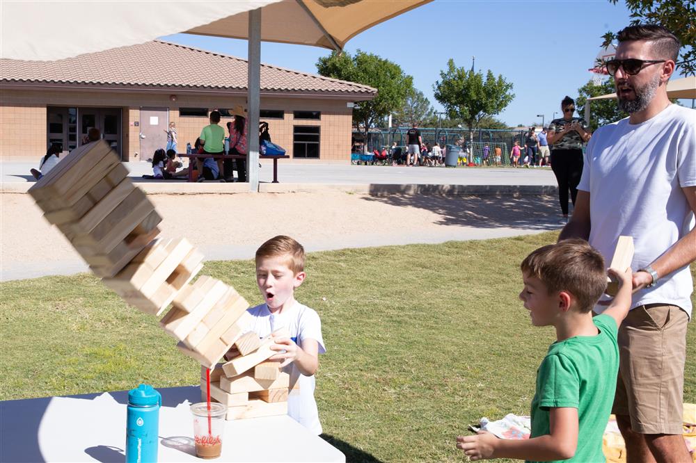 Families visit students during lunch and play games.